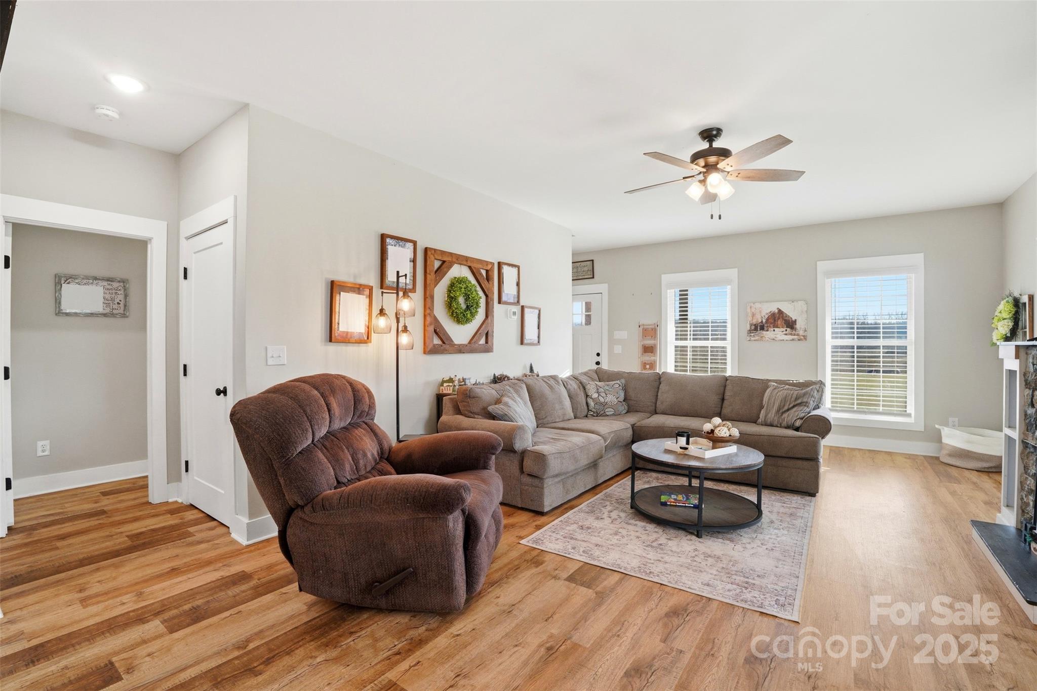 16659 Five Point Road Locust, NC 28097 - Photo 3 of 26 a living room with furniture and wooden floor