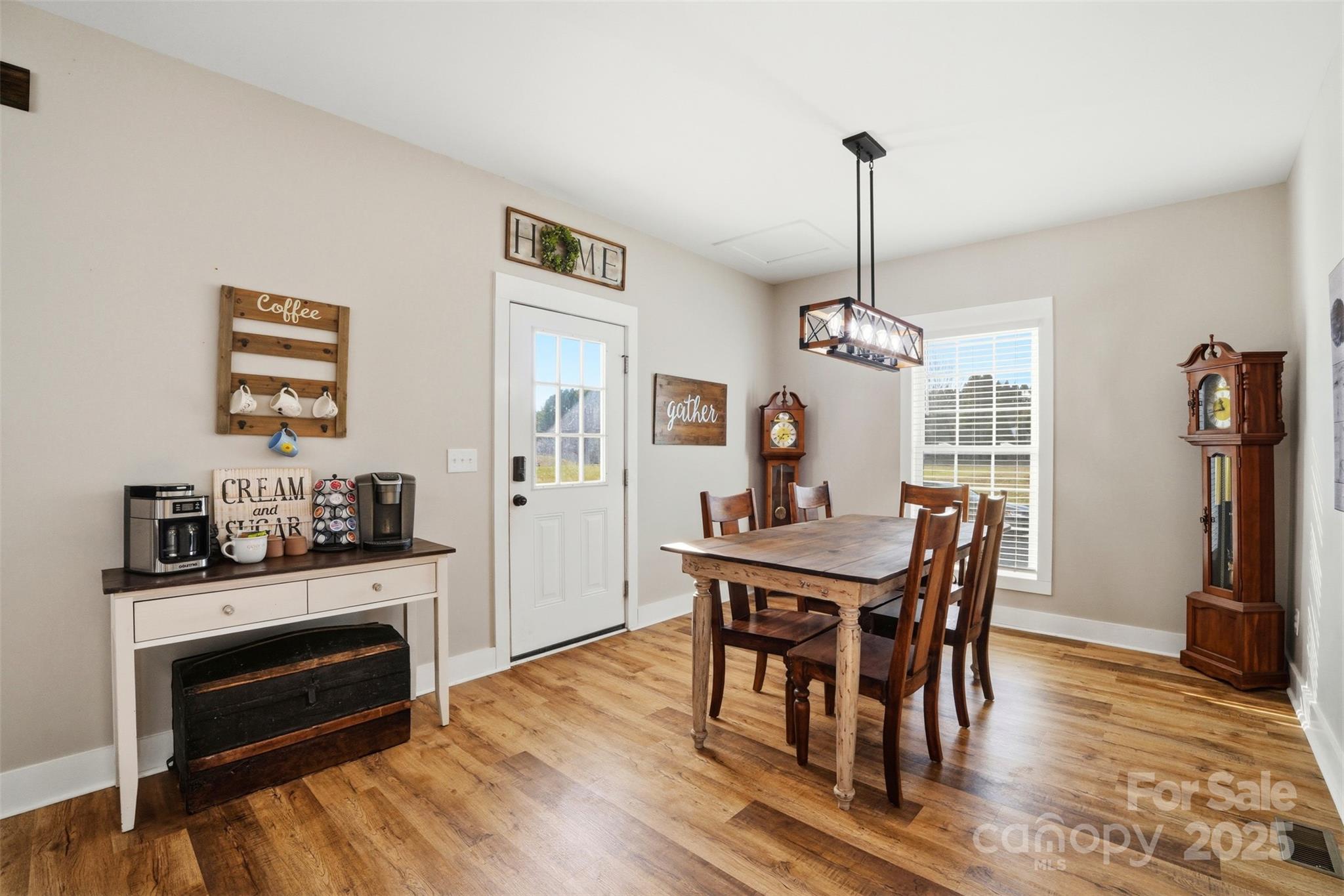 16659 Five Point Road Locust, NC 28097 - Photo 9 of 26 a view of a dining room with furniture window and wooden floor