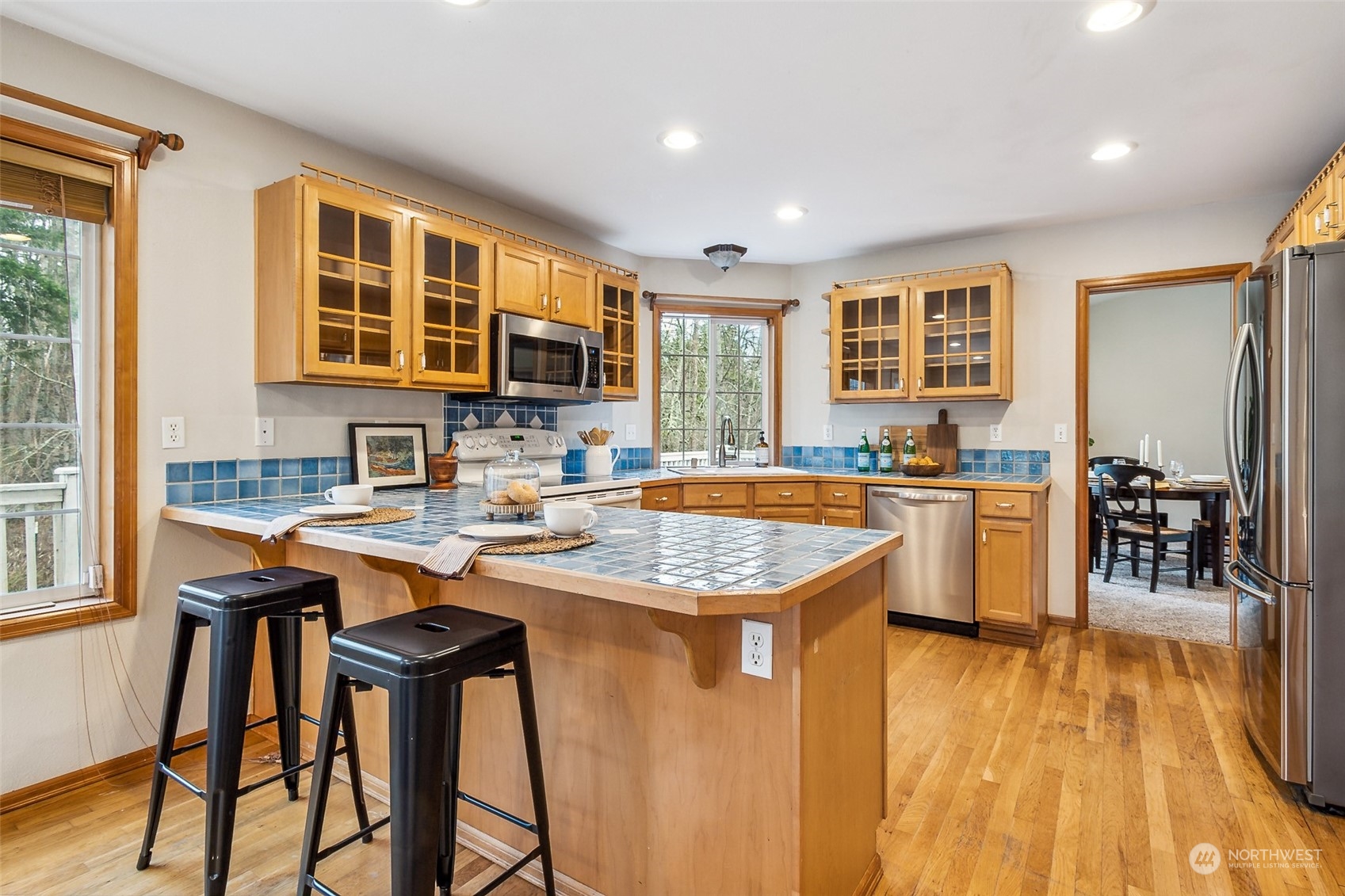 17641 Fennel Road Southeast Yelm, WA 98597 - Photo 13 of 38 a kitchen with counter top space and windows