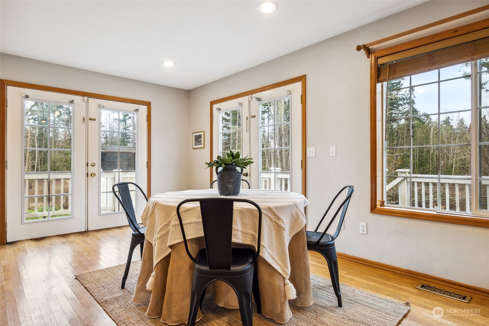 17641 Fennel Road Southeast Yelm, WA 98597 - Photo 16 of 38 a view of a dining room with furniture and wooden floor