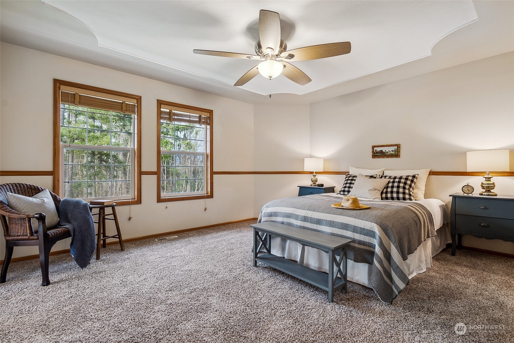 17641 Fennel Road Southeast Yelm, WA 98597 - Photo 22 of 38 a spacious bedroom with a bed and a chandelier