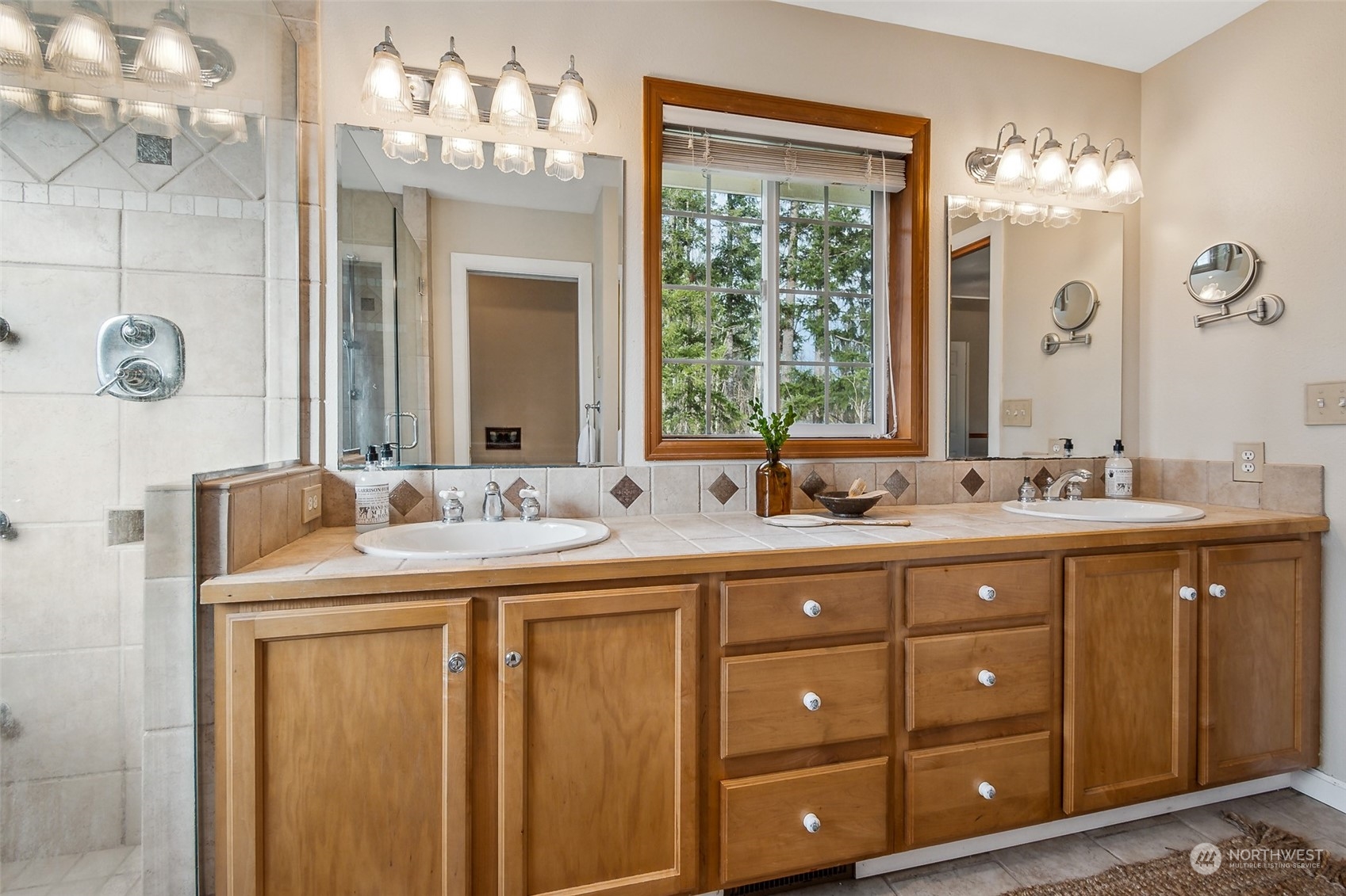 17641 Fennel Road Southeast Yelm, WA 98597 - Photo 24 of 38 a bathroom with a double vanity sink and a mirror