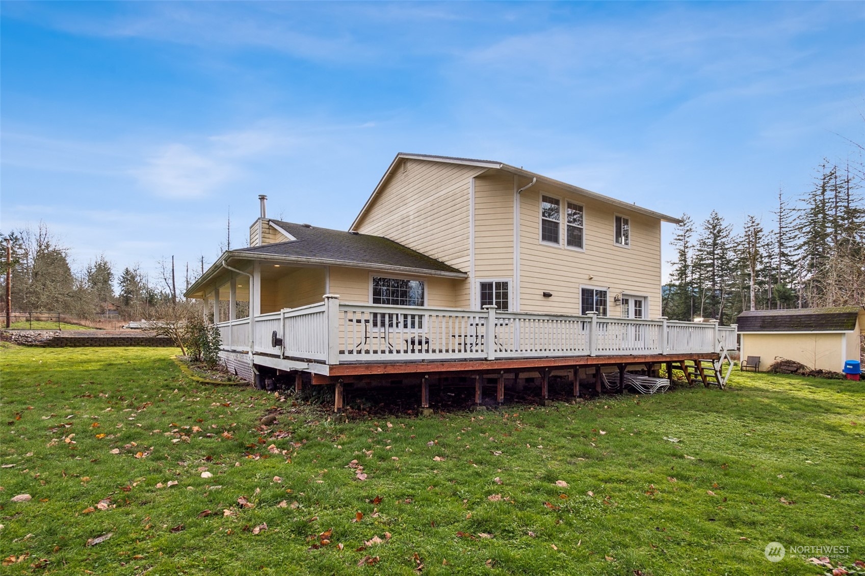 17641 Fennel Road Southeast Yelm, WA 98597 - Photo 29 of 38 a view of a house with a big yard and sitting area