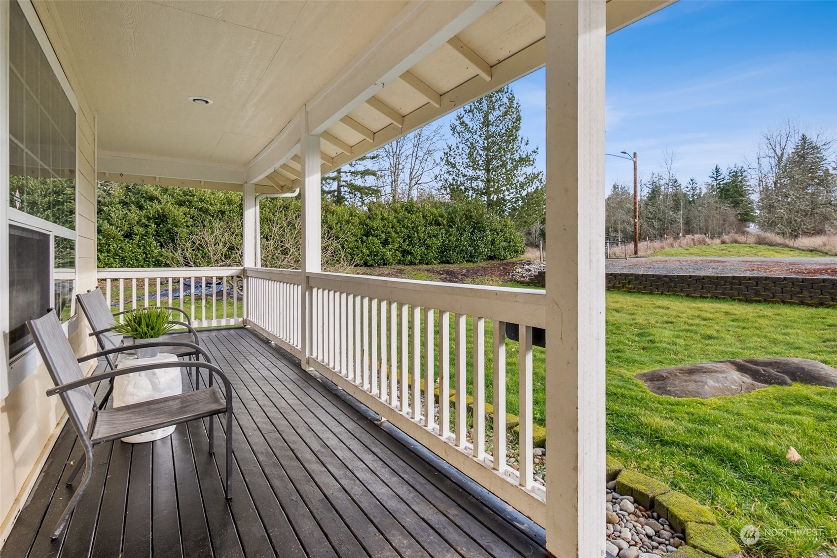 17641 Fennel Road Southeast Yelm, WA 98597 - Photo 4 of 38 a view of balcony with wooden floor and seating space