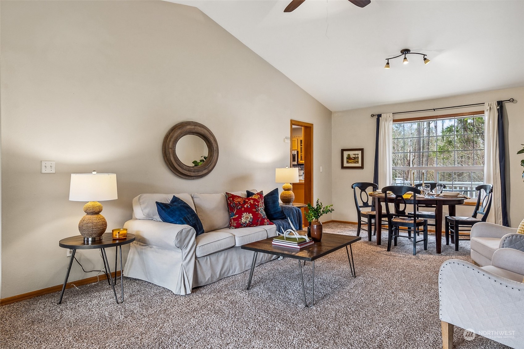 17641 Fennel Road Southeast Yelm, WA 98597 - Photo 8 of 38 a living room with furniture and a large window