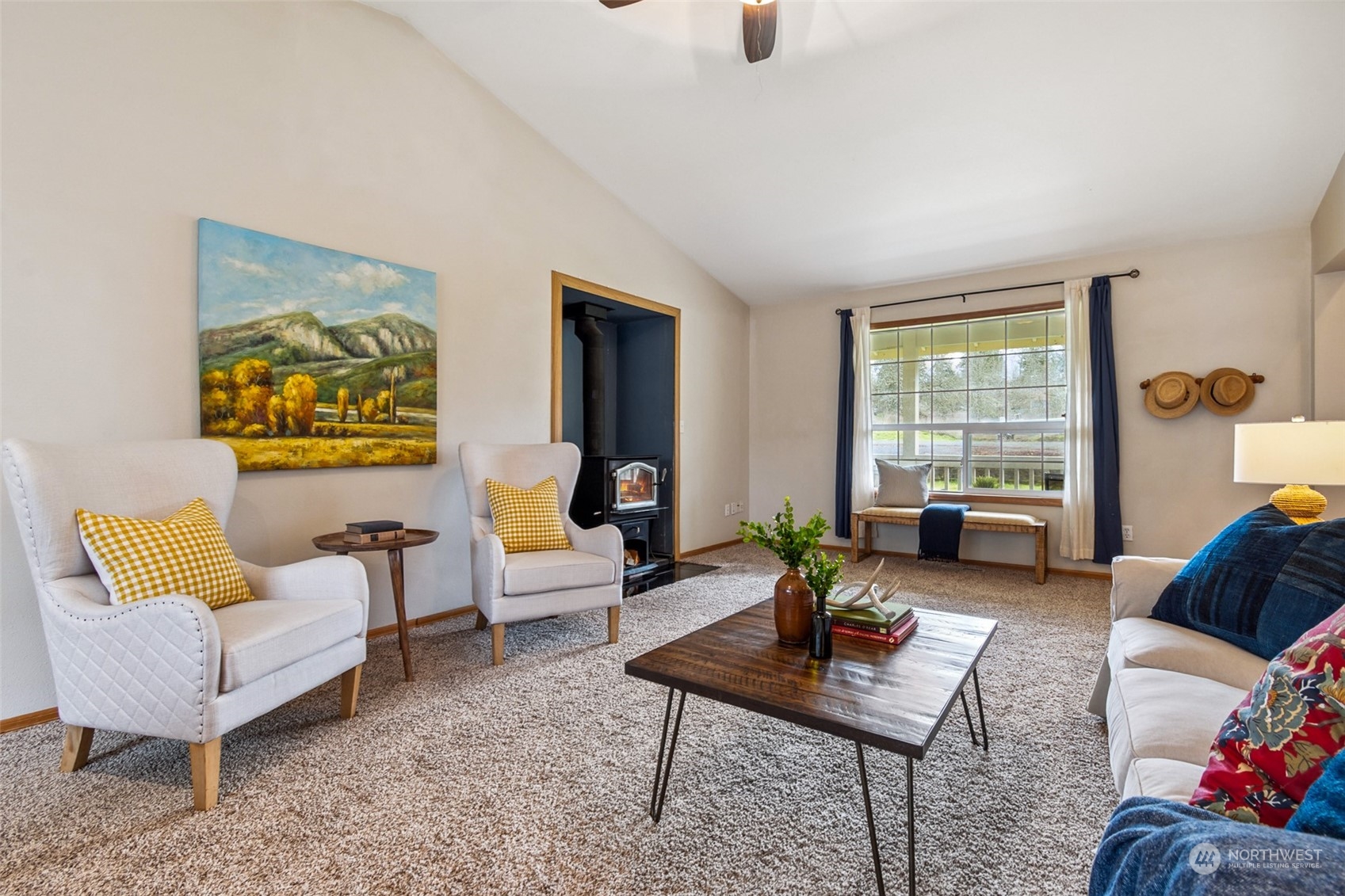 17641 Fennel Road Southeast Yelm, WA 98597 - Photo 10 of 38 a living room with furniture and a large window