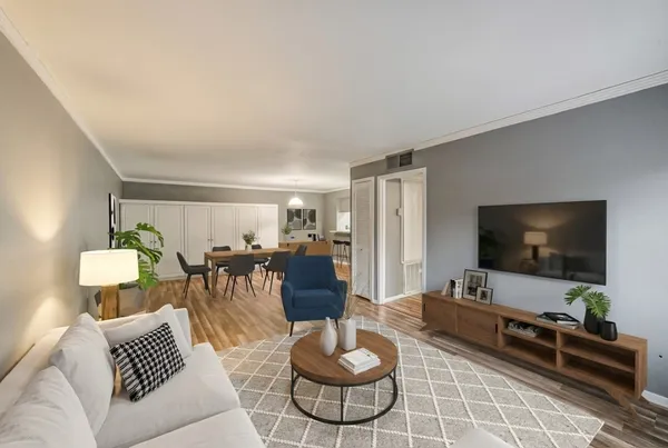 a living room with furniture and a flat screen tv