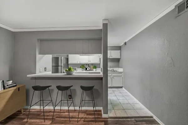 a dining room with a table and chairs