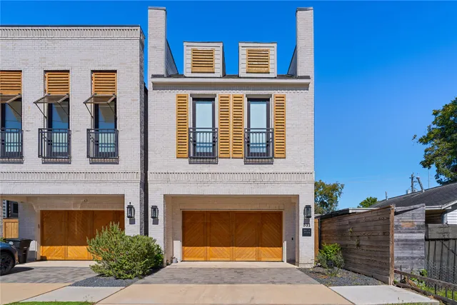 a front view of a house with yard