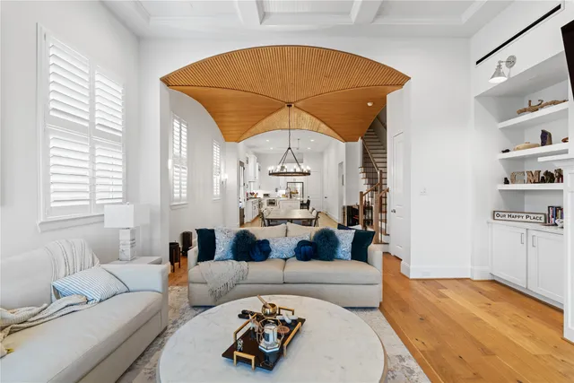 a living room with furniture a couch and dresser