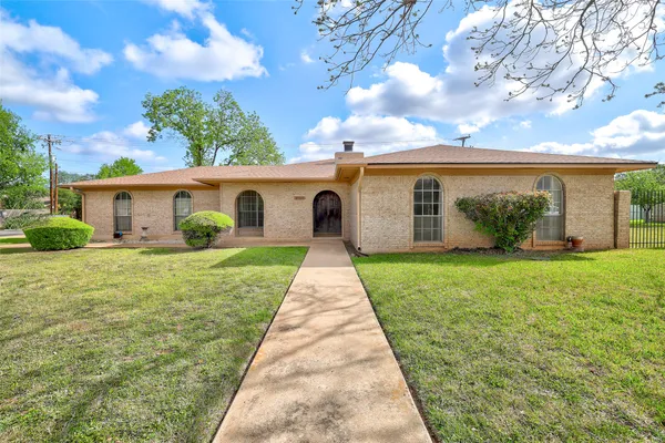 front view of a house with a yard