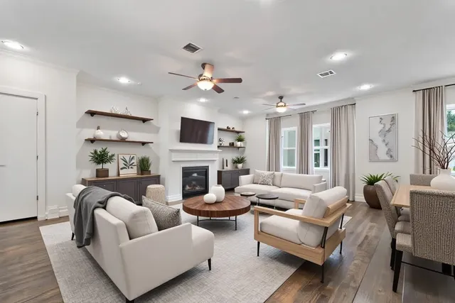 a living room with furniture fireplace and a flat screen tv