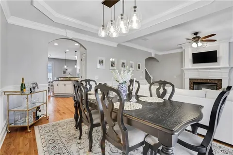 a kitchen with stainless steel appliances granite countertop sink stove and refrigerator