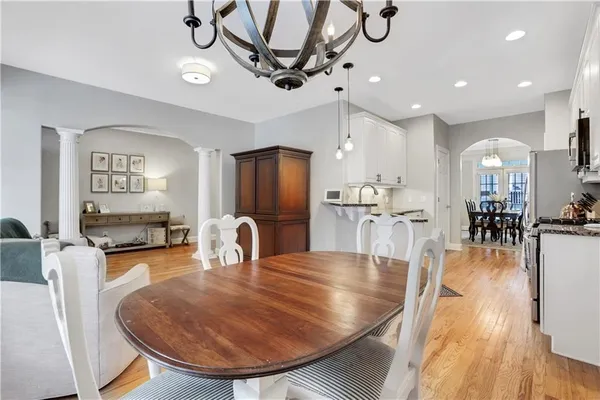 a kitchen with stainless steel appliances granite countertop a refrigerator and a stove top oven