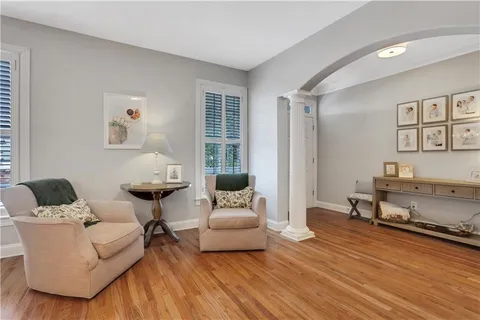 a living room with furniture and a fireplace