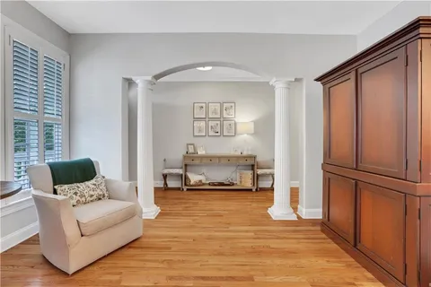 a dining room with furniture and window