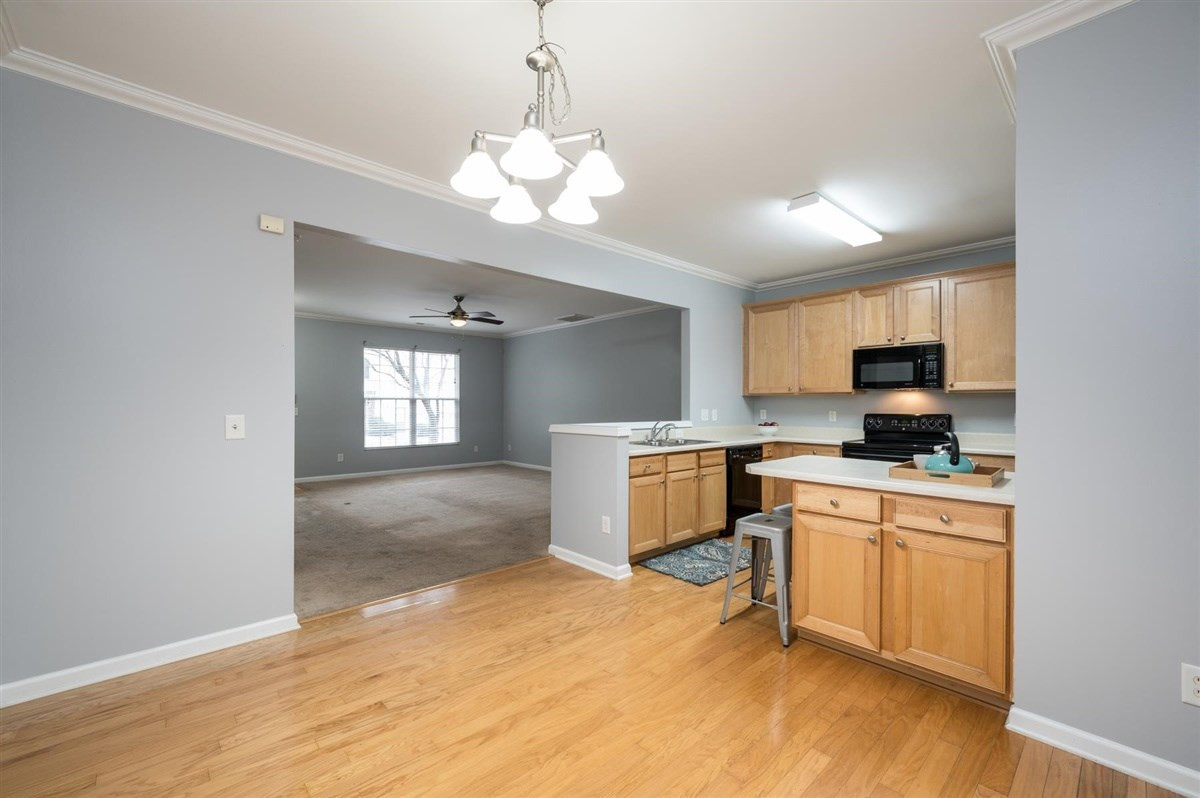 8311 Clasara Circle Raleigh, NC 27613 - Photo 10 of 27 Beautiful kitchen boasts maple cabinets, plenty of counter space, island, and separate pantry. Kitchen