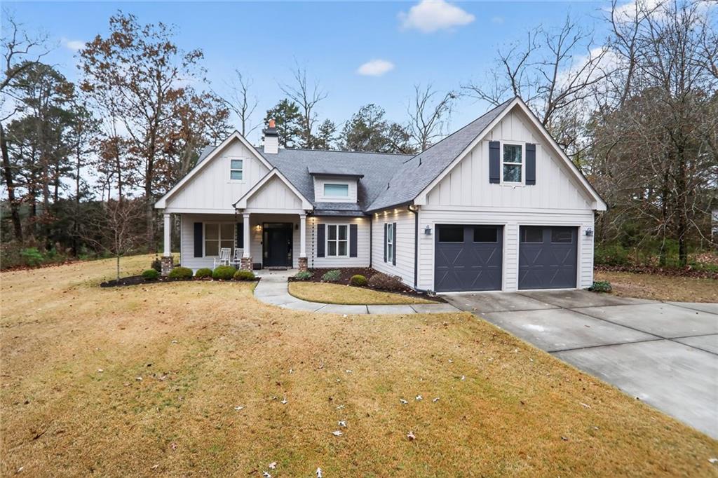 4002 Egypt Road Southwest Snellville, GA 30039 - Photo 1 of 1 a front view of a house with yard and trees