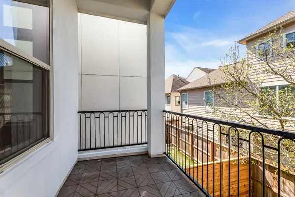 a view of a balcony with wooden floor