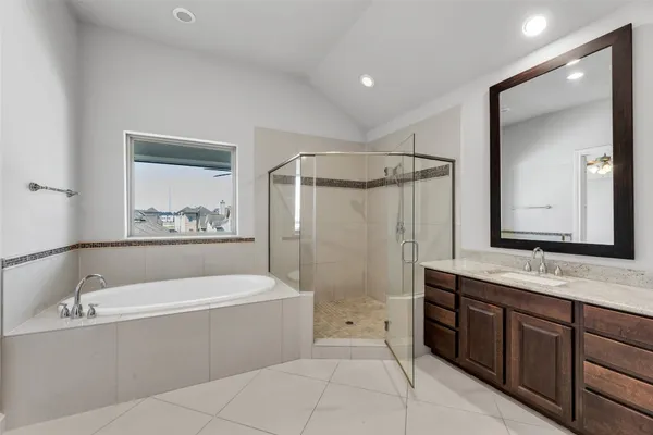 a bathroom with a bathtub and a sink