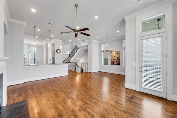 a view of an entryway with wooden floor
