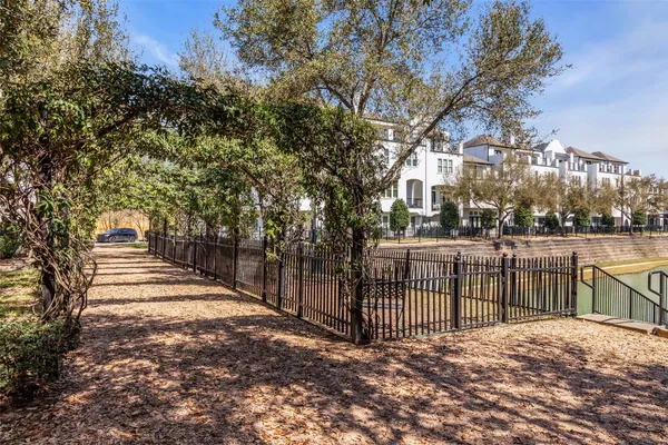 a view of a swimming pool with a yard