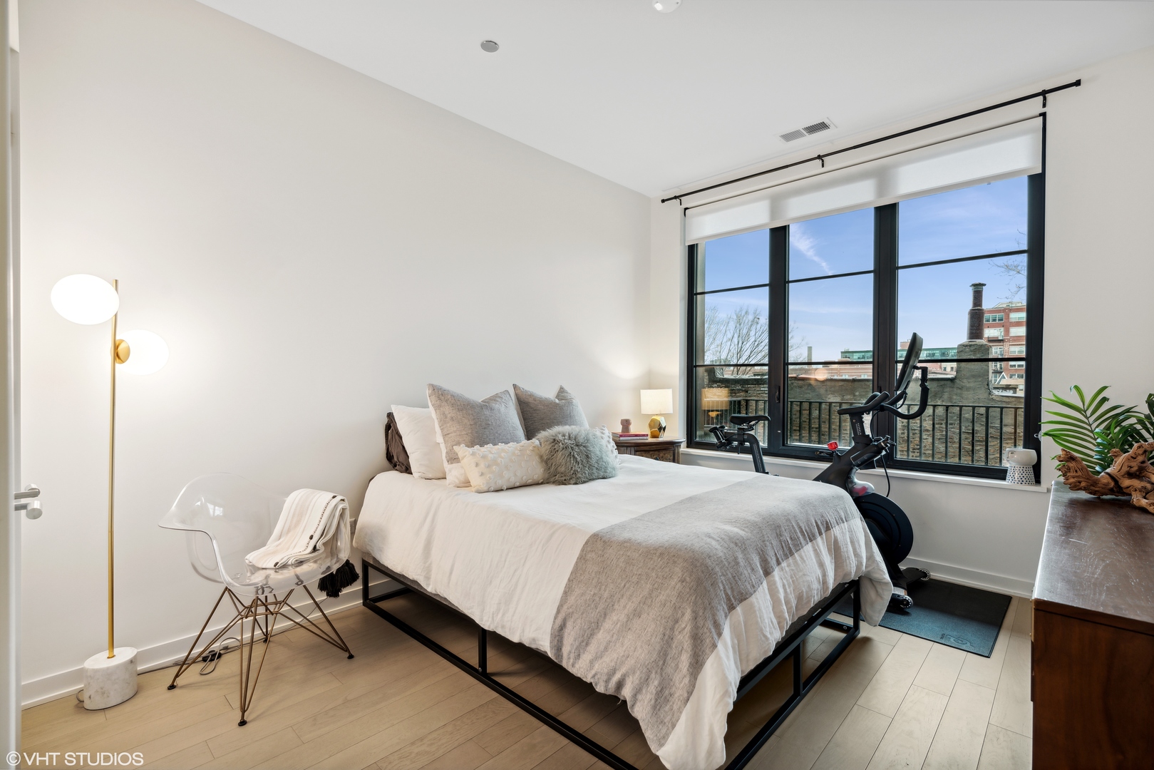 1400 West Monroe Street, Unit 4C Chicago, IL 60607 - Photo 12 of 15 a bedroom with a bed and a large window