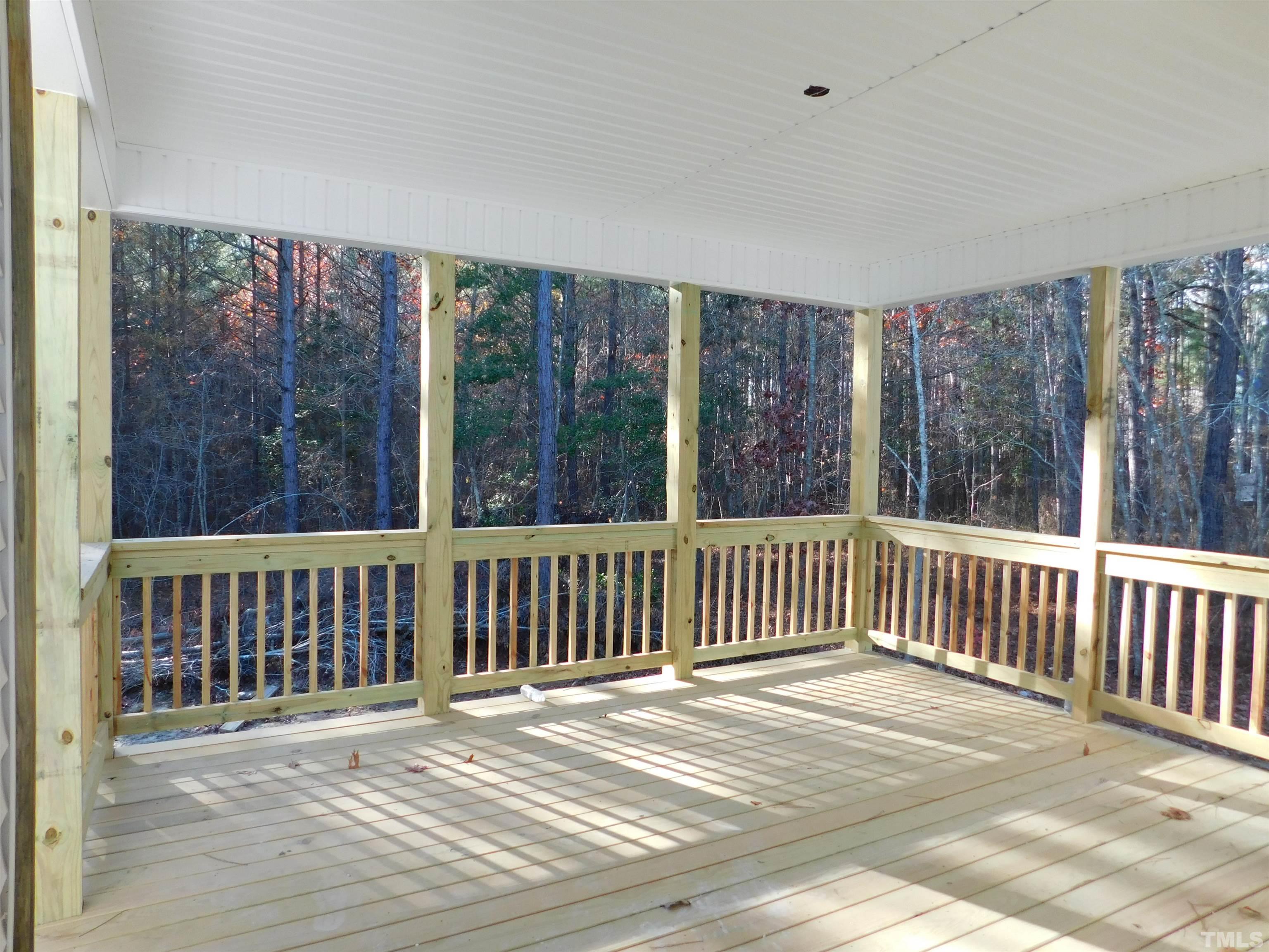 85 Yancey Road Zebulon, NC 27597 - Photo 3 of 10 a view of a balcony with wooden floor