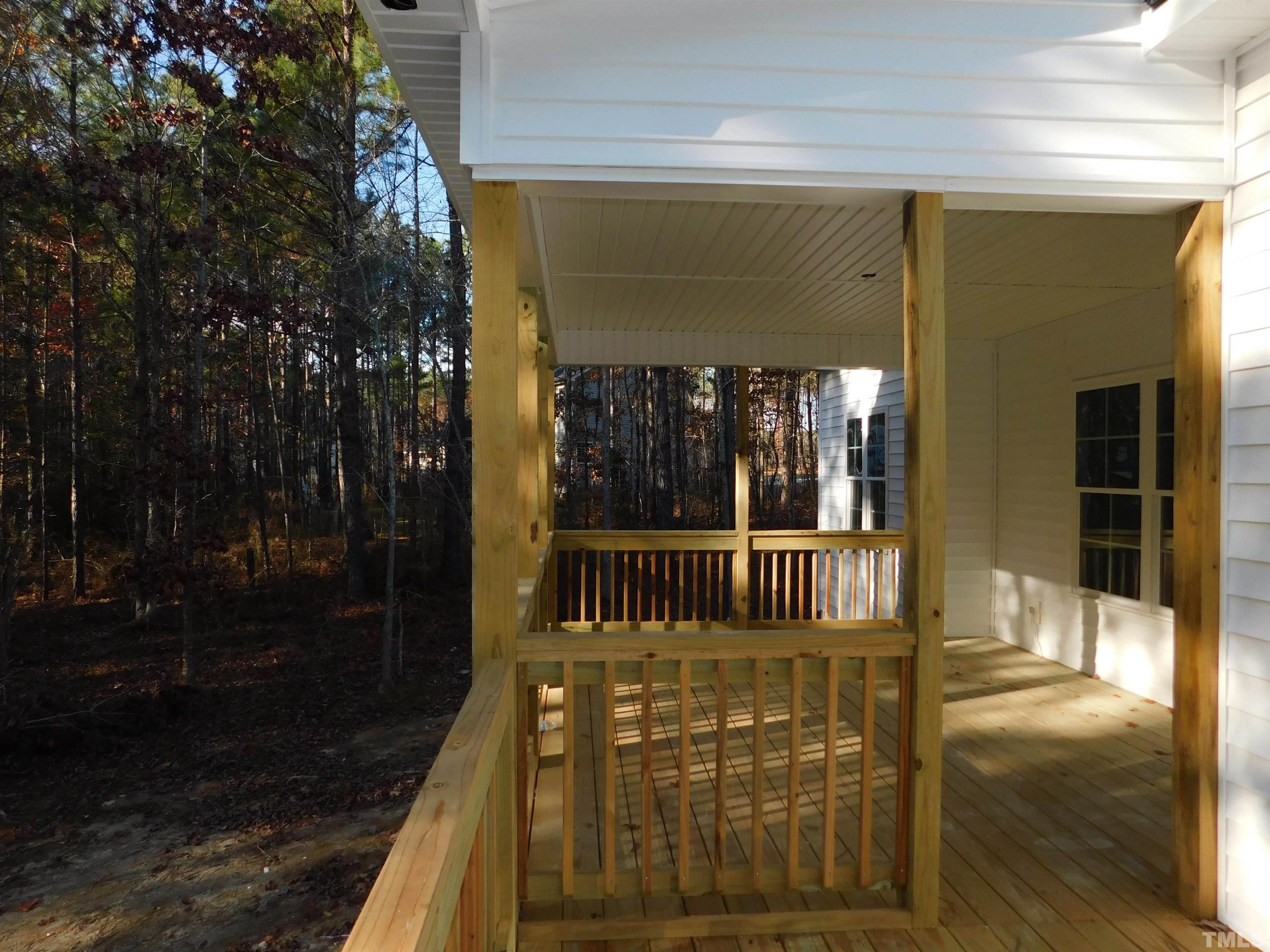 85 Yancey Road Zebulon, NC 27597 - Photo 4 of 10 a view of a porch with a bench