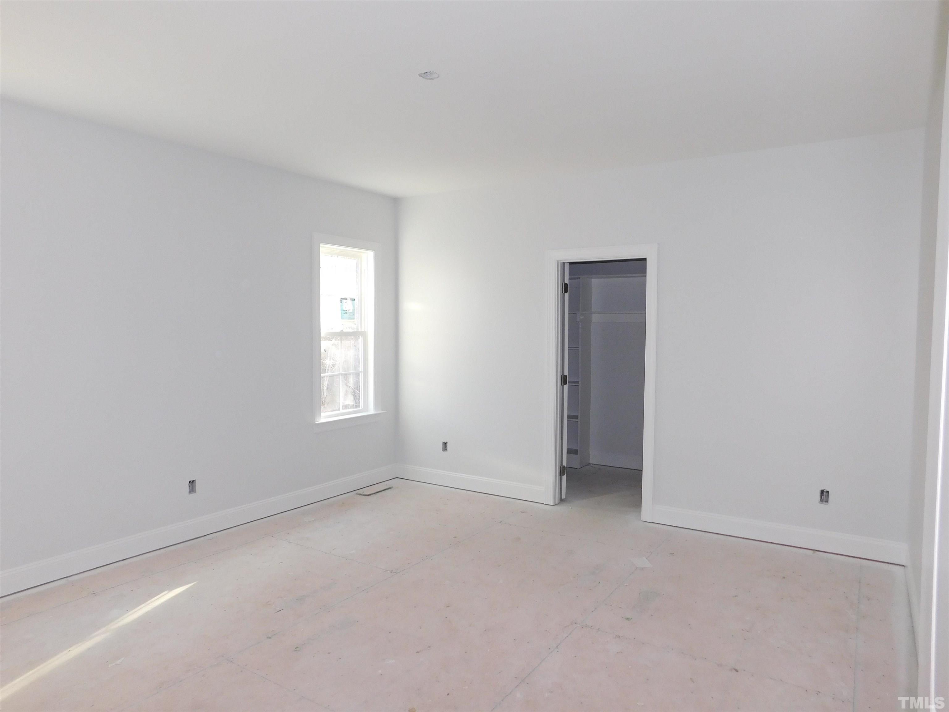 85 Yancey Road Zebulon, NC 27597 - Photo 9 of 10 a view of an empty room with a window