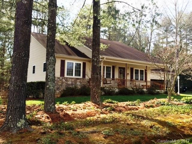 61 Bowman Ridge Road, Unit 5 Hendersonville, NC 28739 - Photo 1 of 24 a front view of a house with a yard