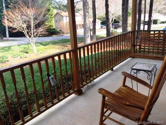 61 Bowman Ridge Road, Unit 5 Hendersonville, NC 28739 - Photo 3 of 24 a view of a two chairs in the balcony