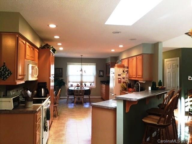 61 Bowman Ridge Road, Unit 5 Hendersonville, NC 28739 - Photo 7 of 24 a kitchen with lots of counter top space