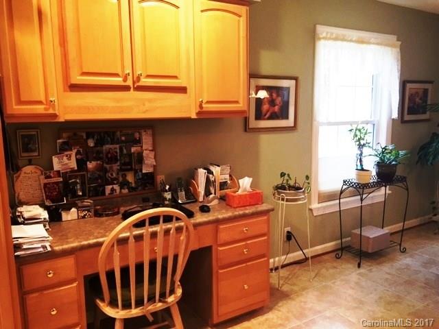 61 Bowman Ridge Road, Unit 5 Hendersonville, NC 28739 - Photo 10 of 24 a room with gym equipment and a window