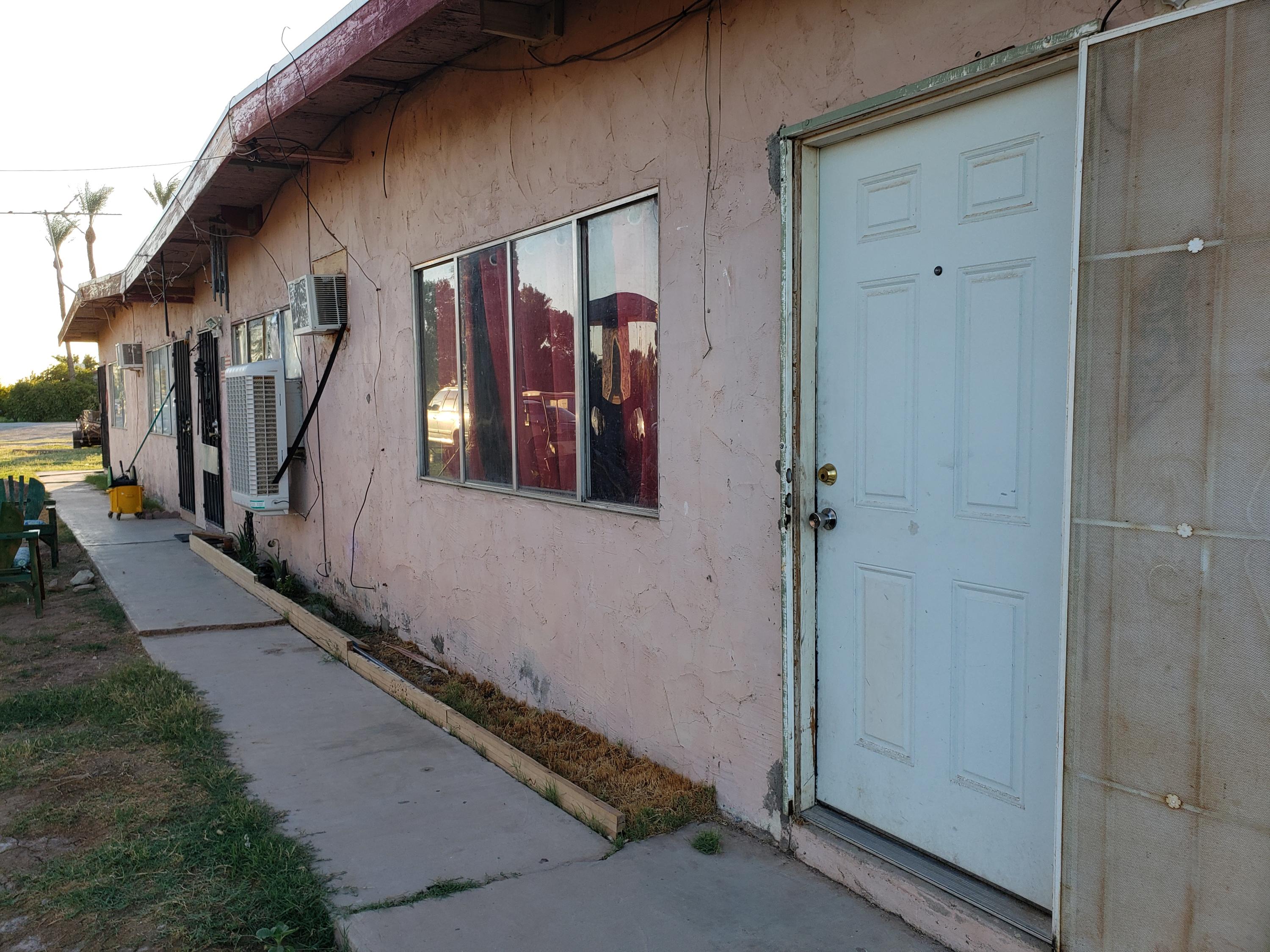 2139 Thomas Road Blythe, CA 92225 - Photo 6 of 9 a view of a hallway with a door and stairs