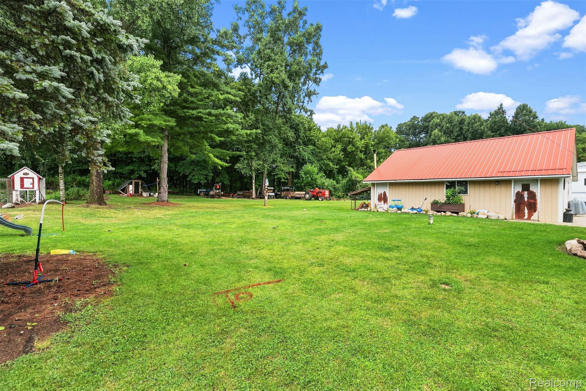 3319 Valentine Road Lapeer, MI 48446 - Photo 31 of 39 Expansive green lawn and mature trees