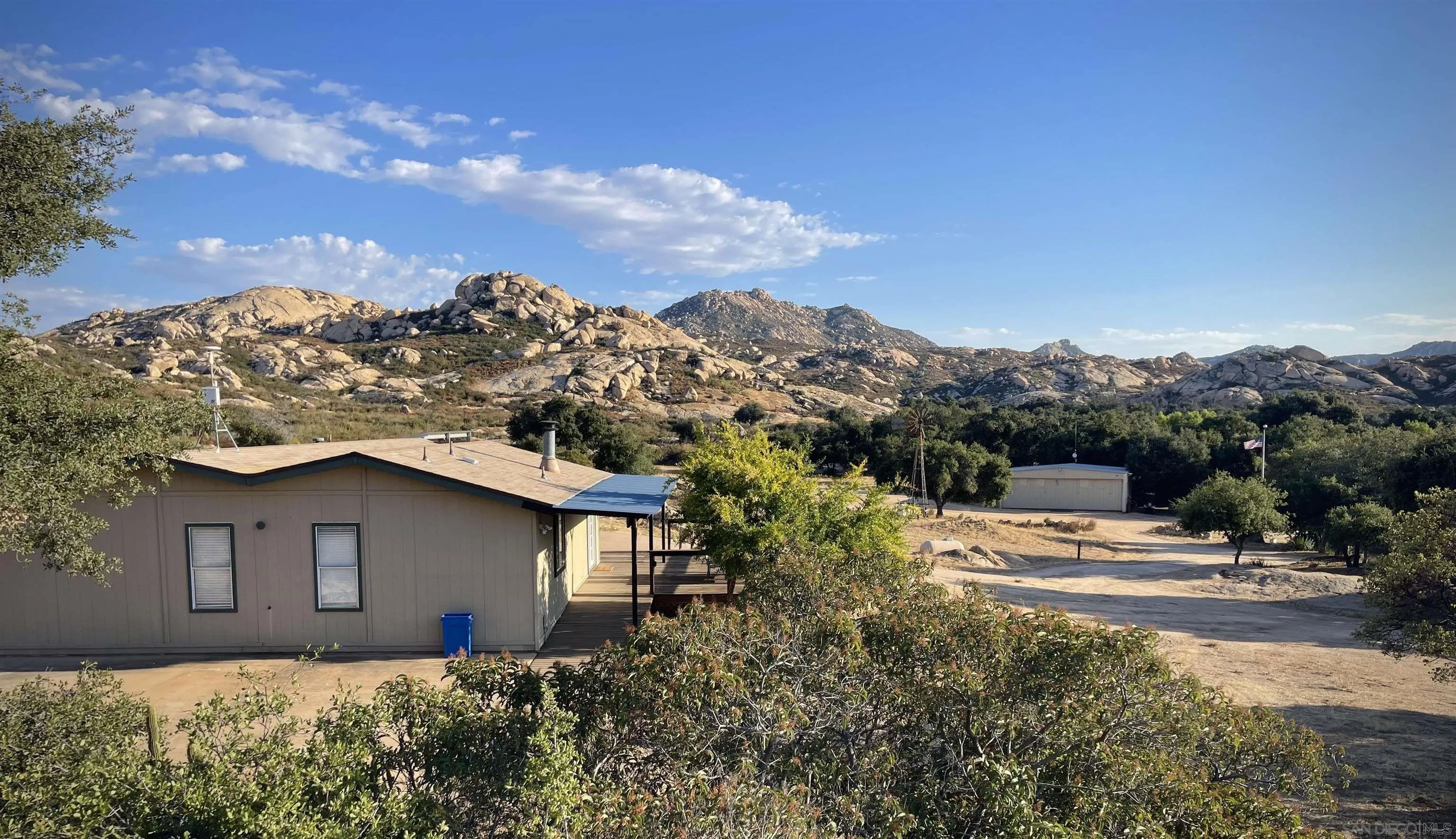 19191 High Glen Road, Unit 4 Alpine, CA 91901 - Photo 6 of 10 a view of a house with a yard