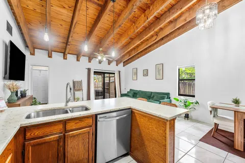 a spacious bathroom with a granite countertop sink and a large mirror