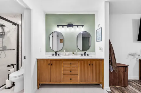 a bathroom with a shower and toilet
