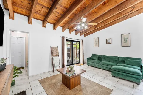 a living room with furniture and a rug