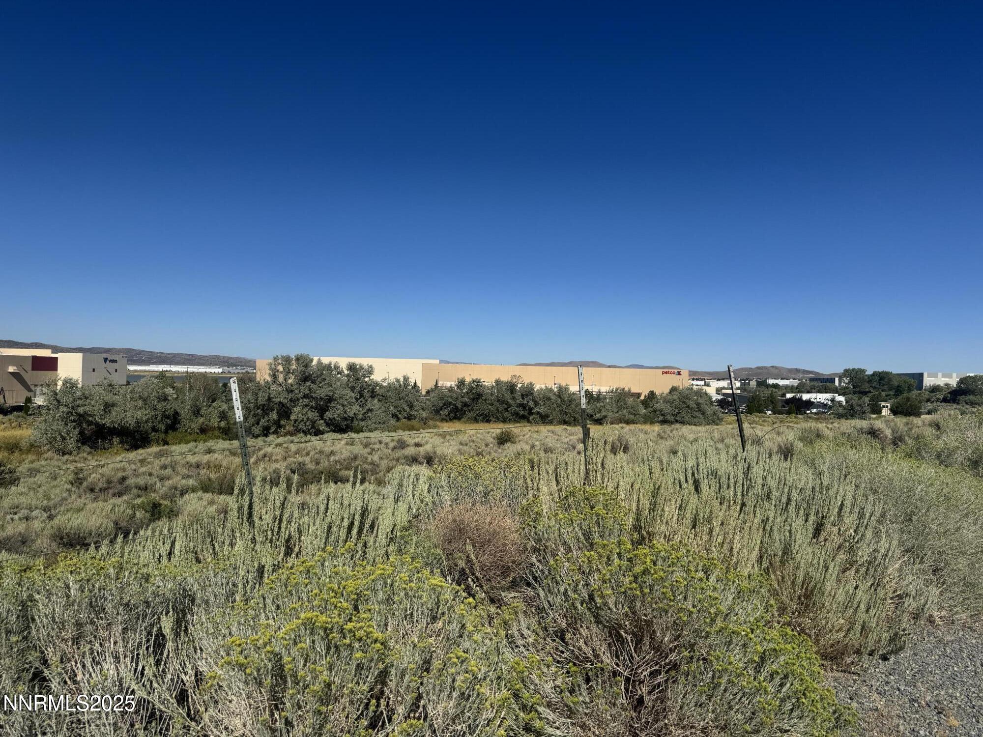 9500 North Red Rock Road Reno, NV 89508 - Photo 15 of 16 a view of a green field with an ocean view