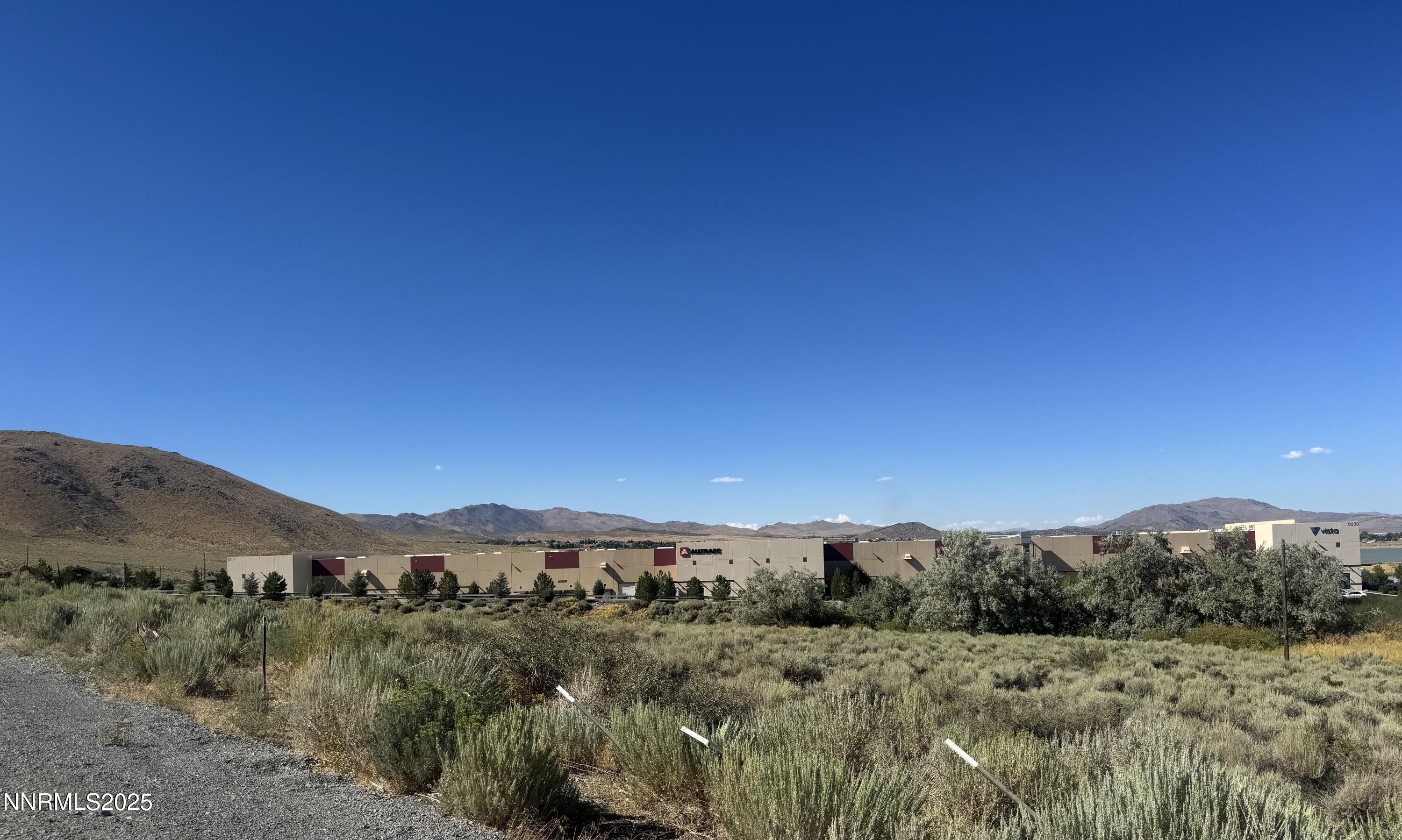 9500 North Red Rock Road Reno, NV 89508 - Photo 4 of 16 a view of a city with a mountain in the background
