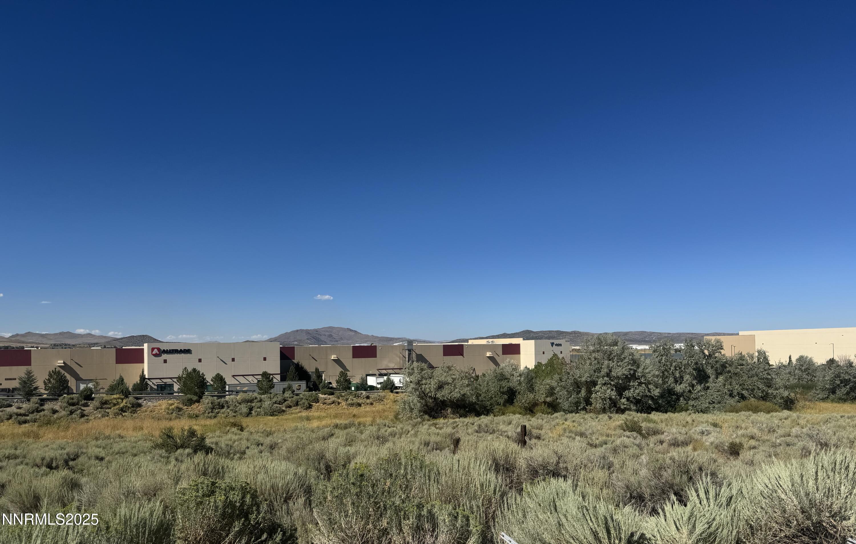 9500 North Red Rock Road Reno, NV 89508 - Photo 8 of 16 a view of a dry yard with trees