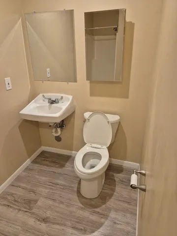 a bathroom with a toilet and a sink