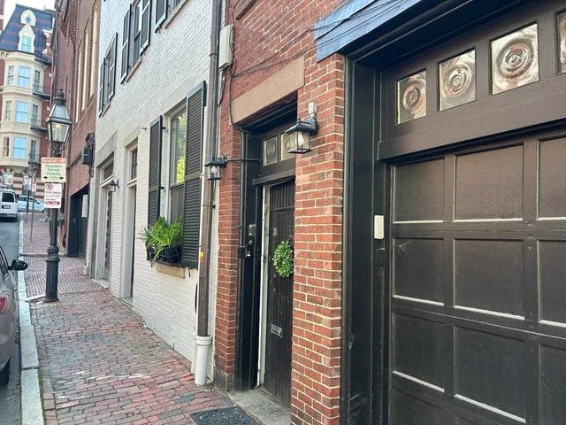 a view of a street with seating area
