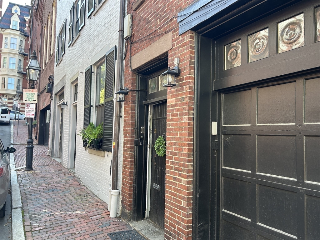 a view of a street with seating area