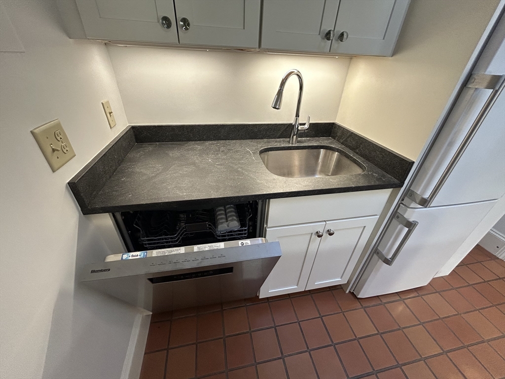 31 Branch Boston Ma, Unit 2 Boston, MA 02108 - Photo 4 of 11 a kitchen with a sink and cabinets
