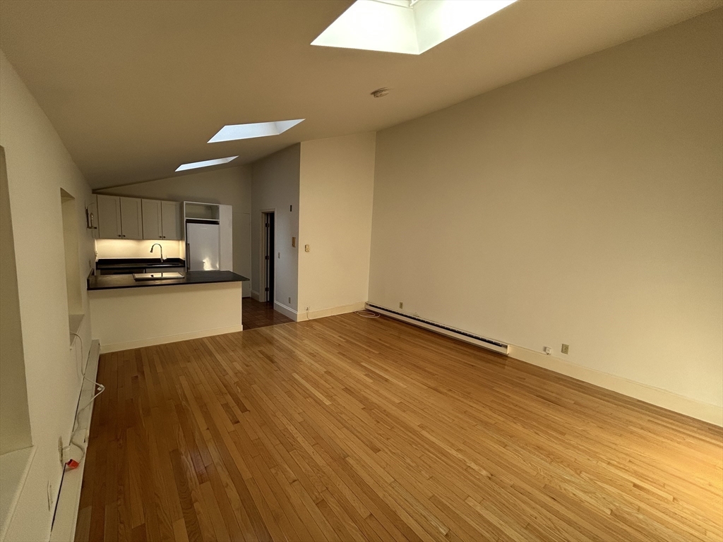31 Branch Boston Ma, Unit 2 Boston, MA 02108 - Photo 5 of 11 a view of a kitchen with a sink and a stove