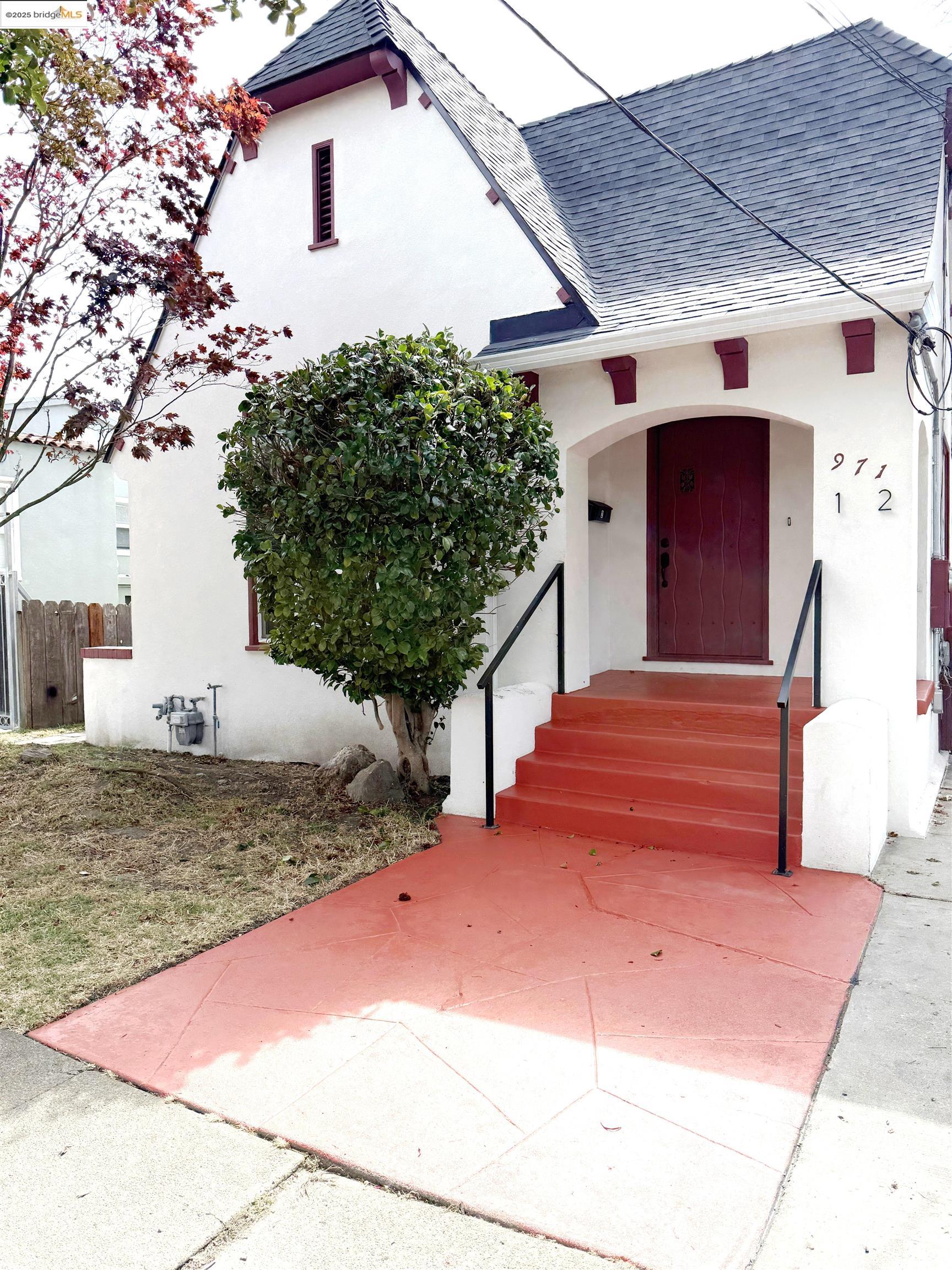 971 34th Street Richmond, CA 94805 - Photo 1 of 58 View of front of property with a shingled roof and stucco siding