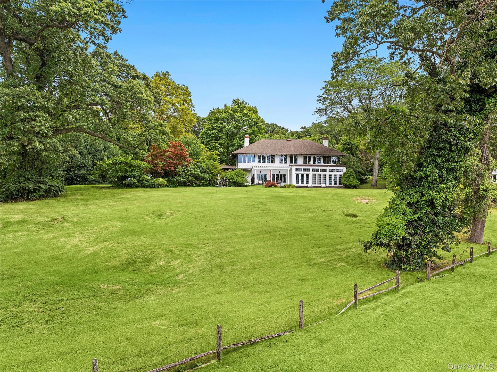 45 Cedar Lane Sands Point, NY 11050 - Photo 6 of 18 a view of a big yard with large trees